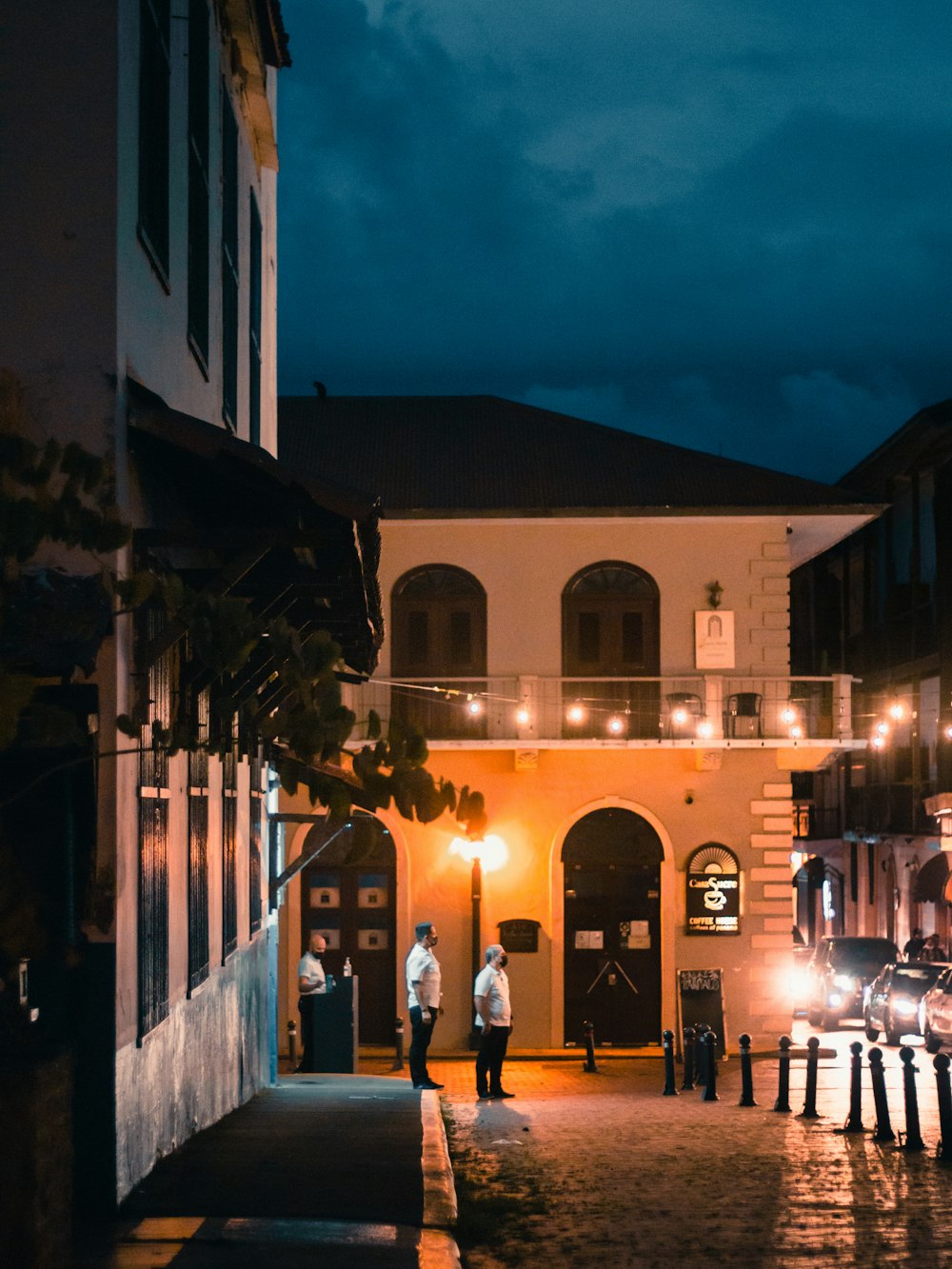 a couple of people that are standing outside of a building