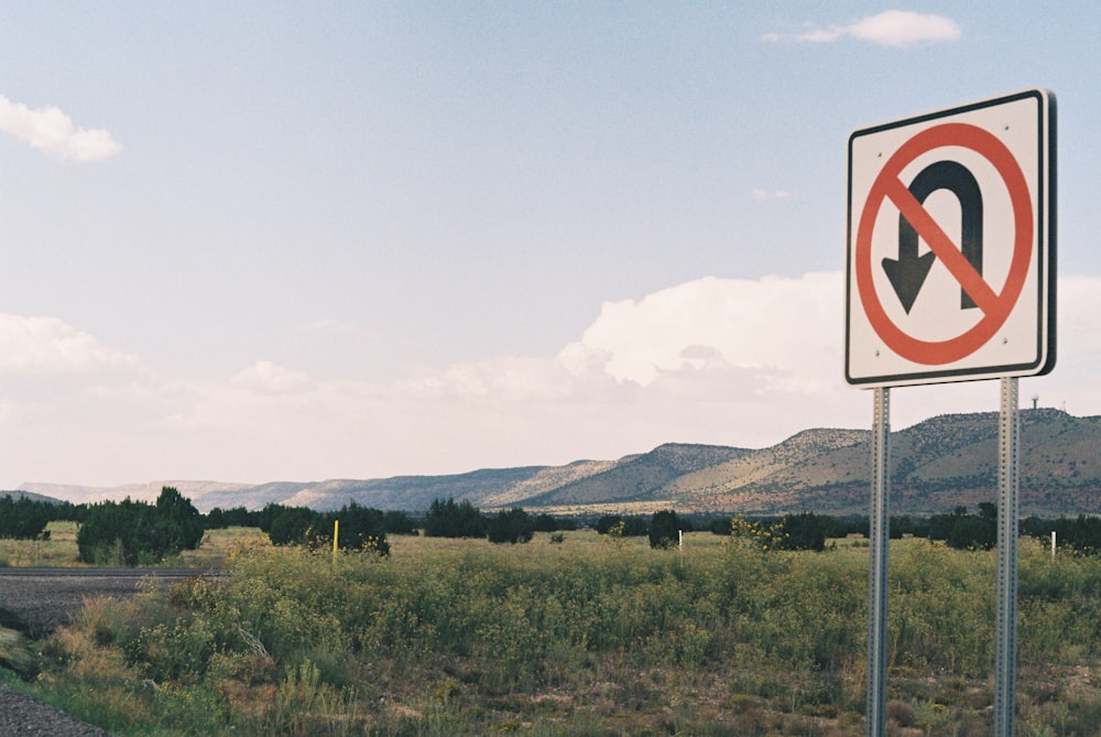 a no left turn sign on the side of the road