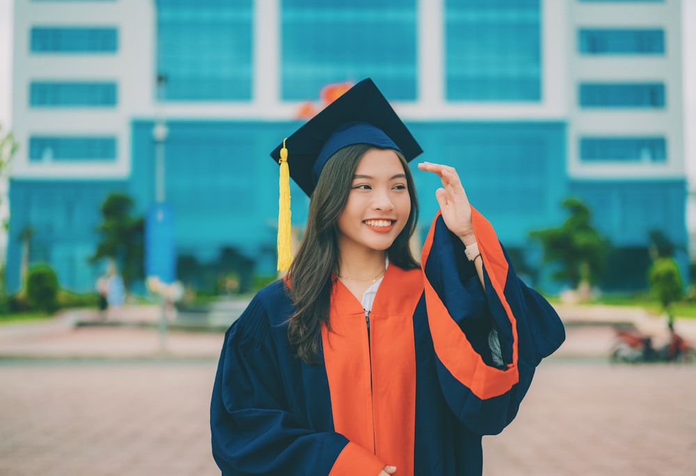 a woman in a graduation cap and gown