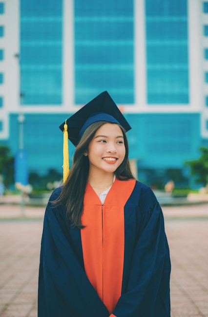 a woman in a graduation cap and gown
