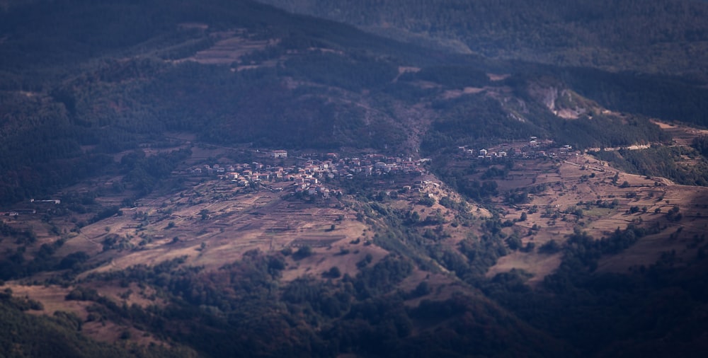 an aerial view of a village in the mountains