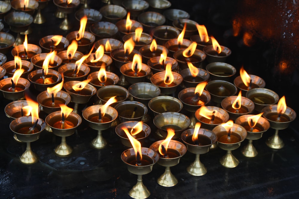 a bunch of candles that are on a table