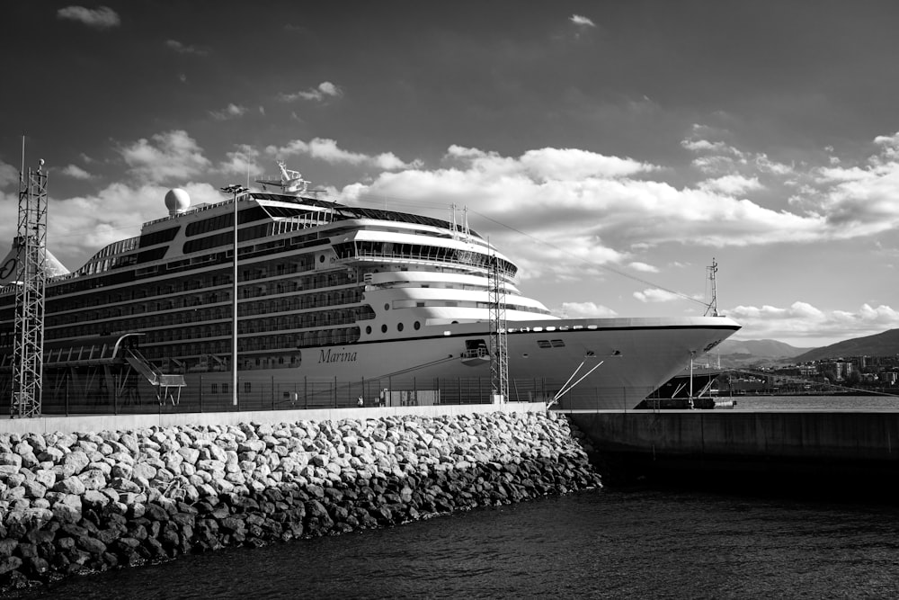 a large cruise ship docked at a dock