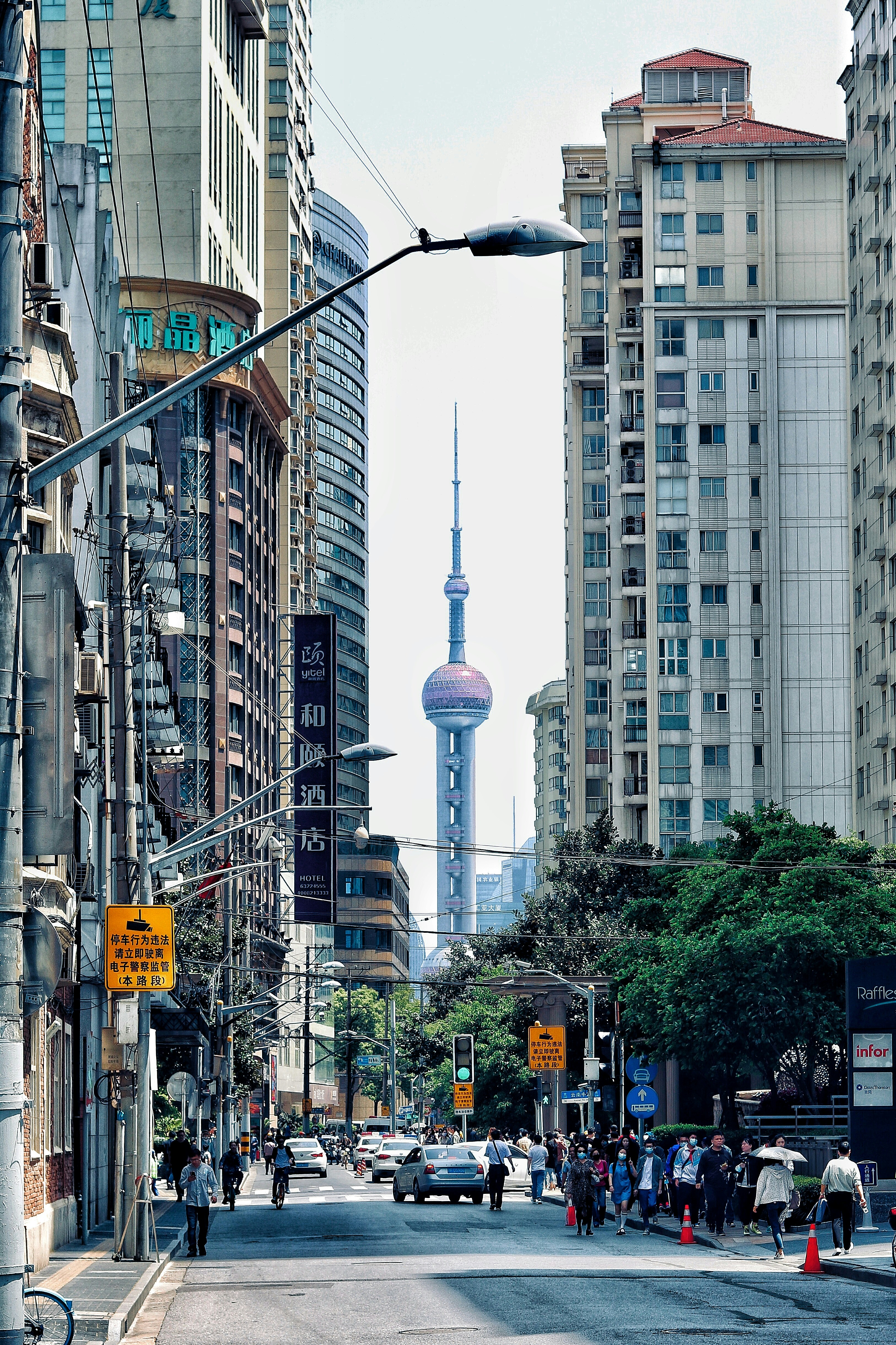 a city street filled with lots of tall buildings