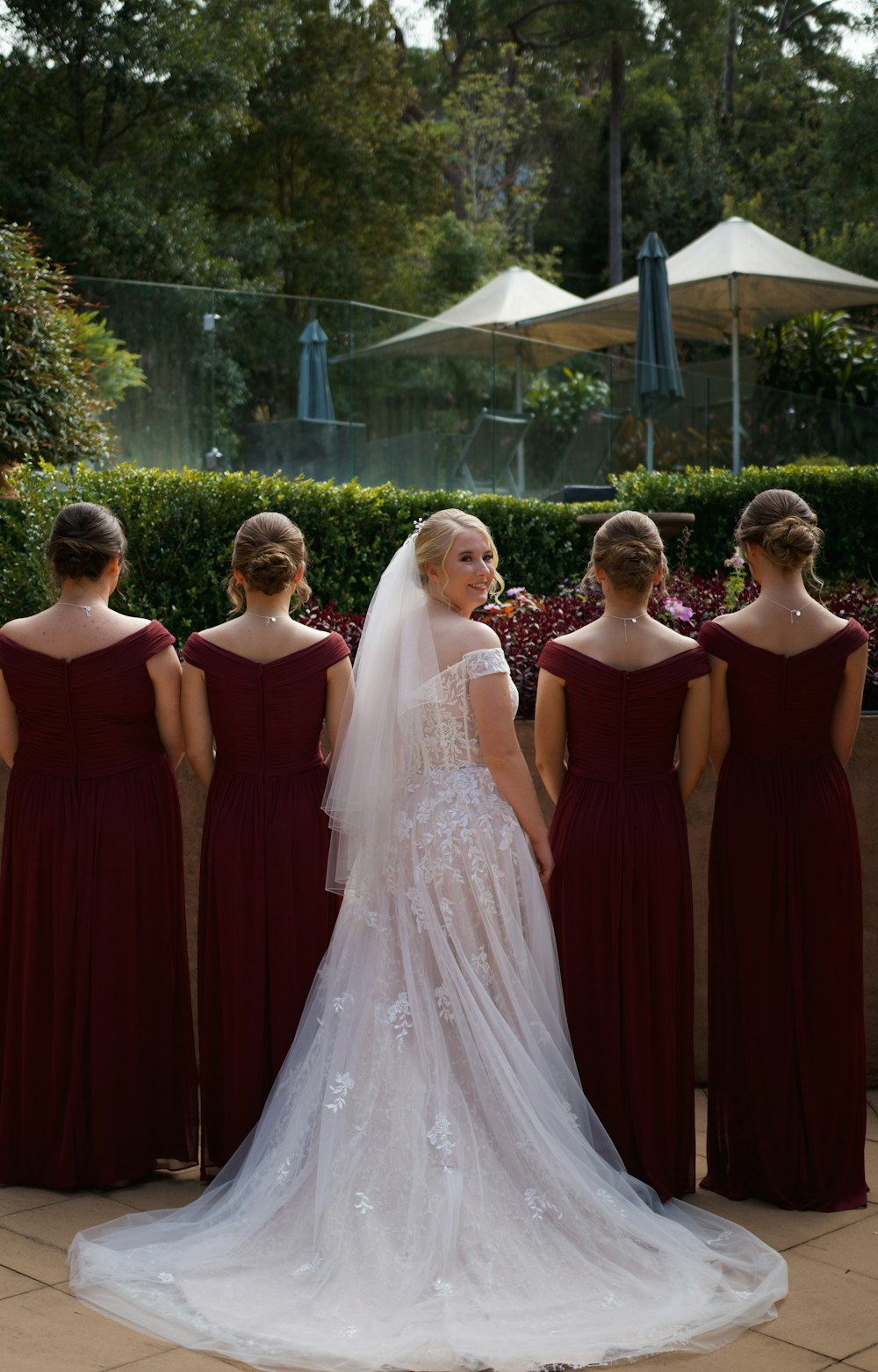 a bride and her bridesmaids standing together