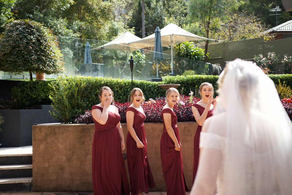 a group of women standing next to each other