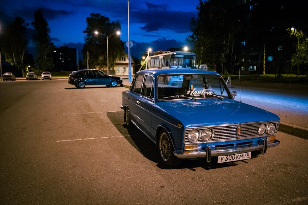 a blue car parked on the side of the road