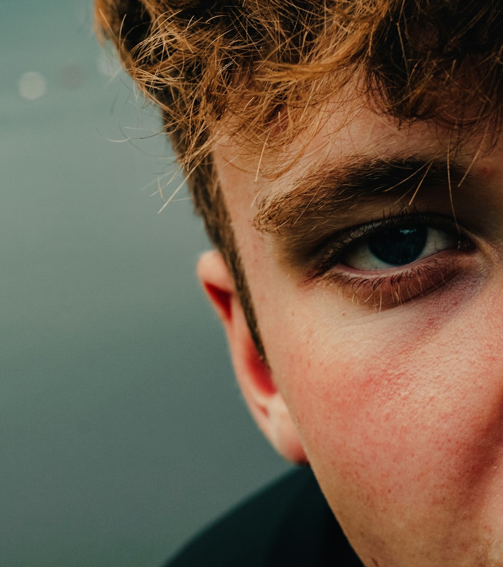 a close up of a person with a tie on