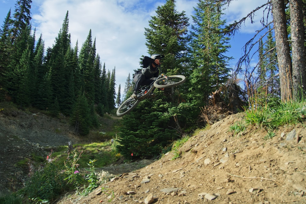 a person jumping a bike in the air