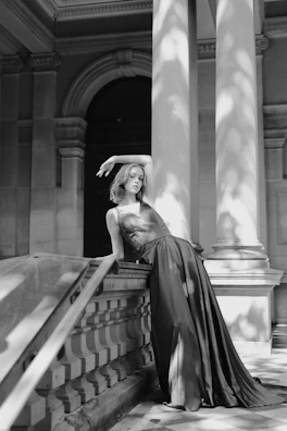 Elegant black and white photo highlighting the silhouette of a minimalist dress.