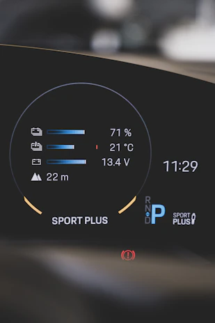 Close-up of a digital dashboard displaying battery health and performance stats.