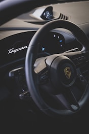 a steering wheel and dashboard of a car