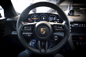 a steering wheel and dashboard of a car