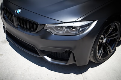 a close up of the front of a black car