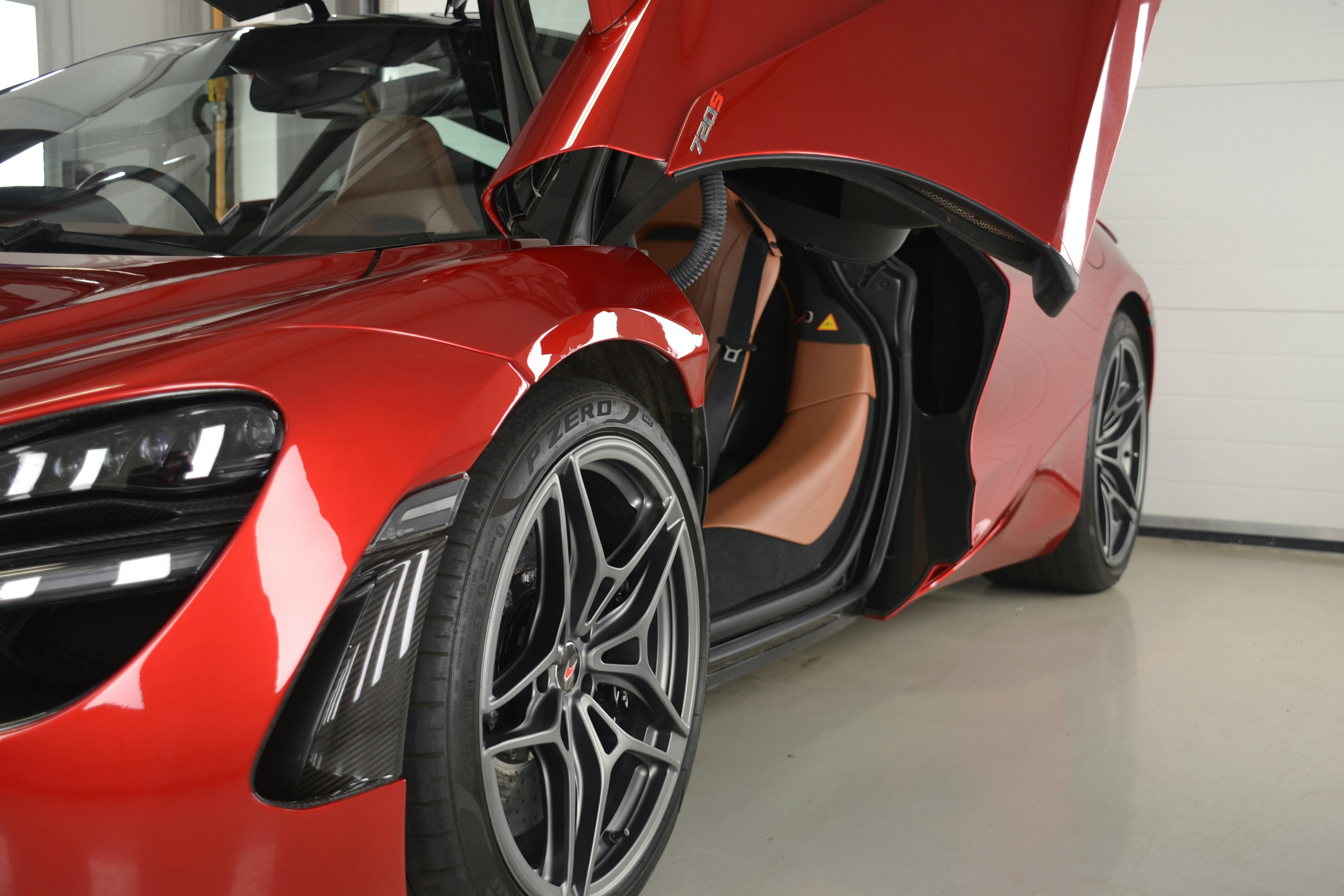 a red sports car parked in a garage