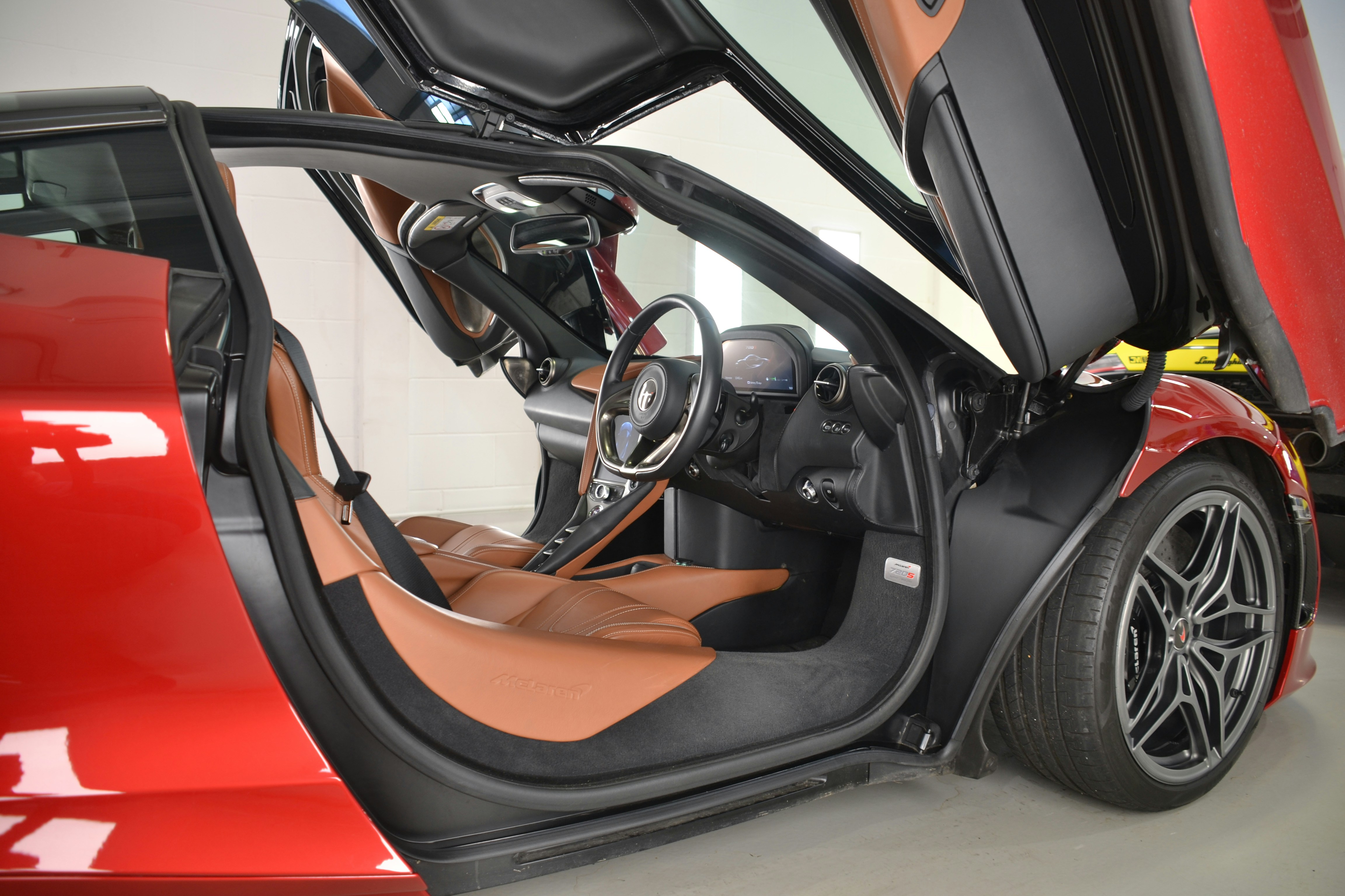 a red sports car with its door open