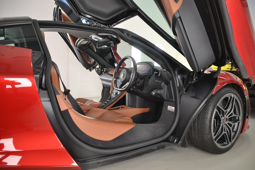 a red sports car with its door open