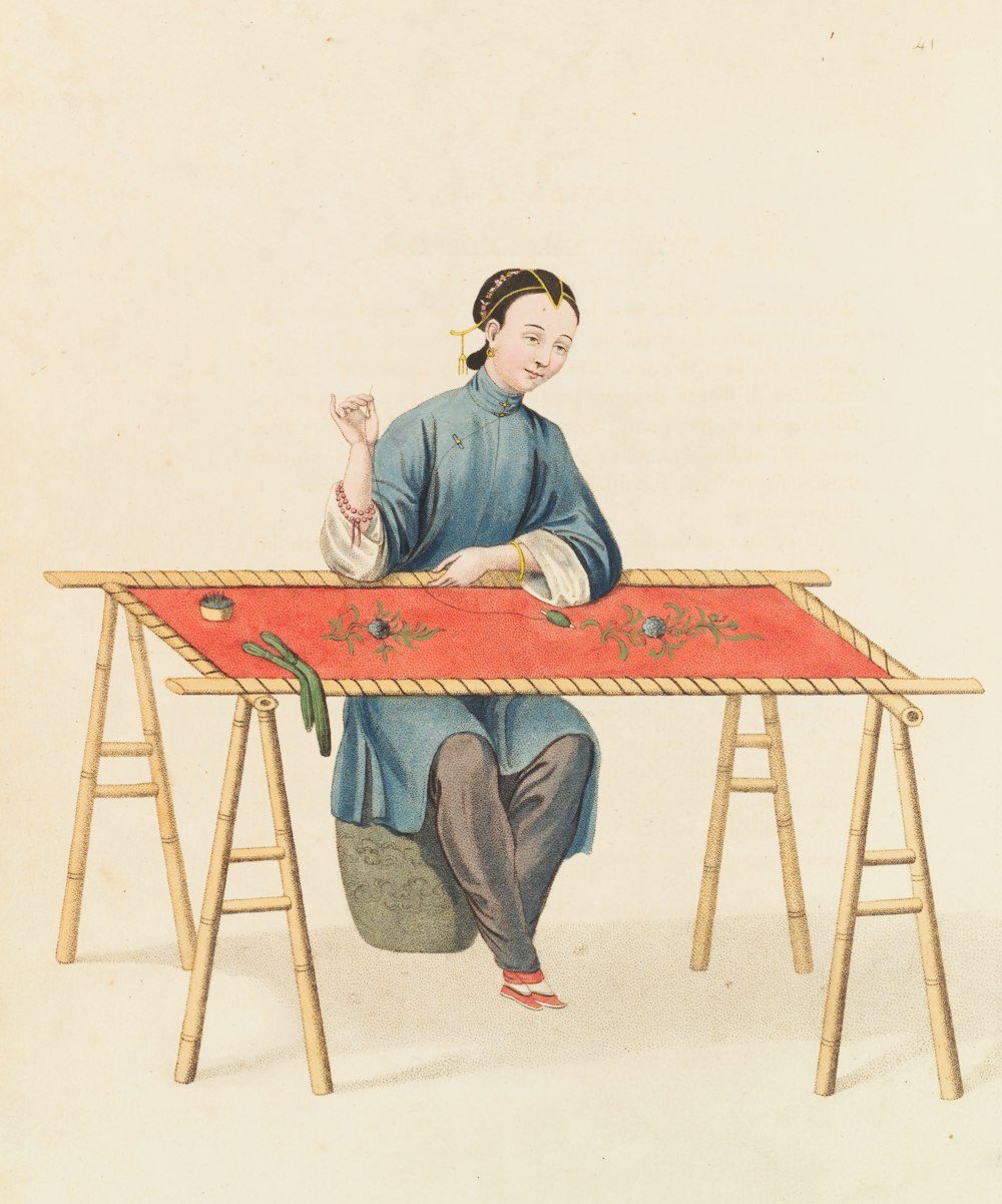 a painting of a woman sitting at a table