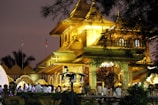 Devotees gathered at the Ayodhya temple entrance during a serene sunrise