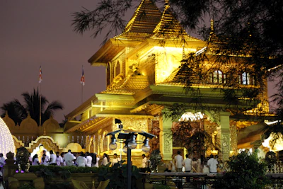 early morning sunlight bathing the temple entrance with priests preparing for worship