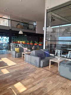 Bright and airy common area with soft colors and comfortable furniture fostering community.