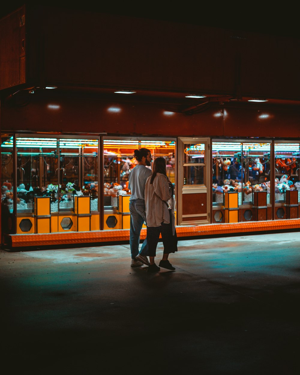 a man and a woman standing in front of a store