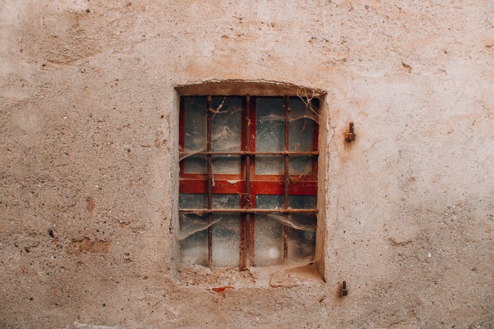 a window with bars on the outside of it