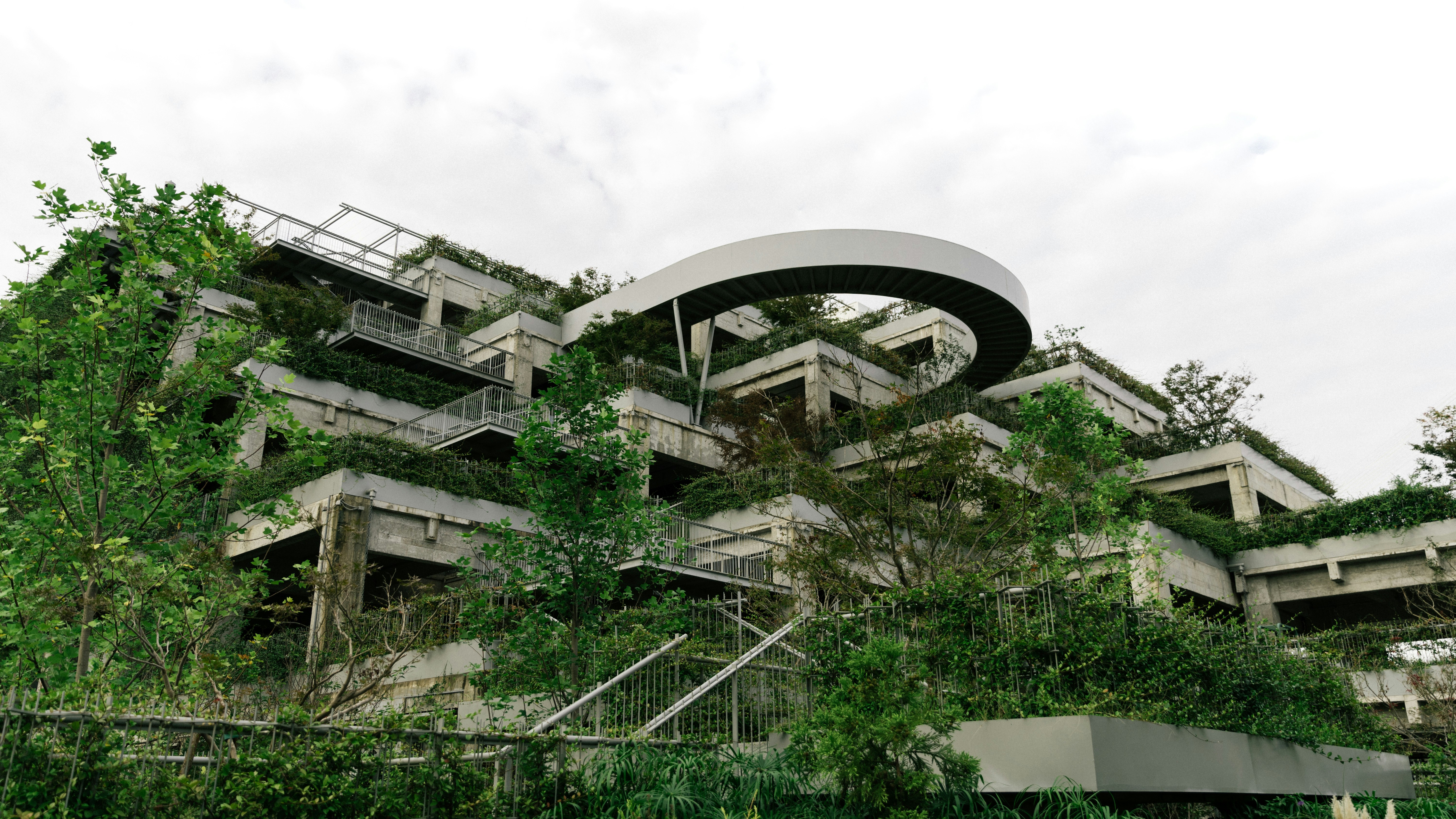 a building that has a bunch of plants growing on it
