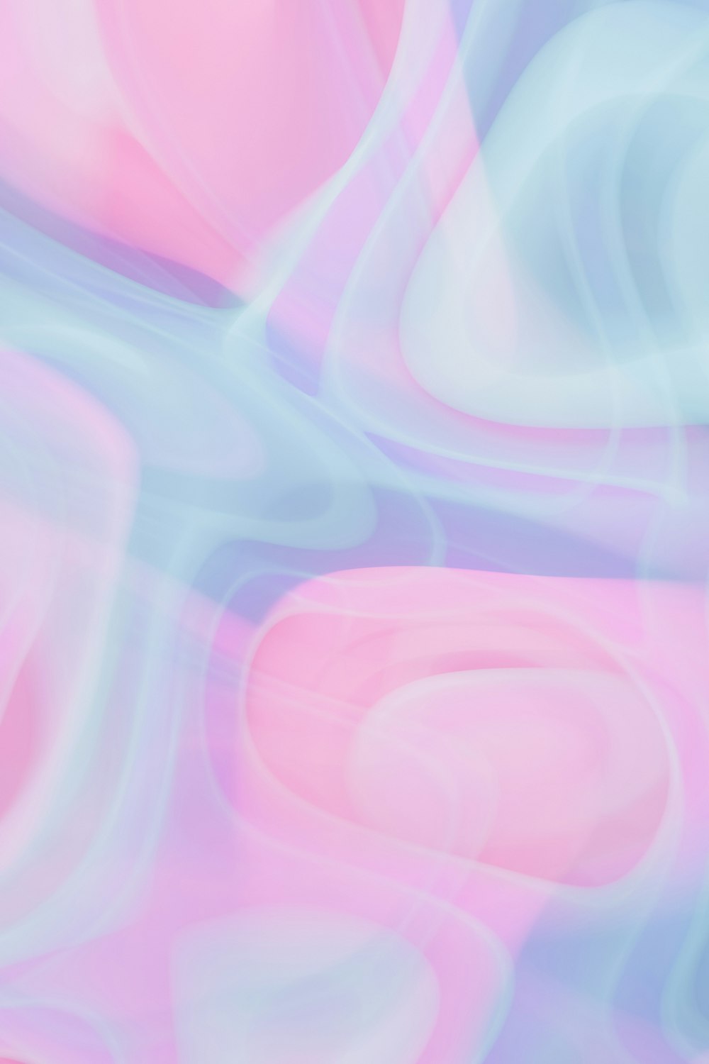 a blurry image of a pink and blue background