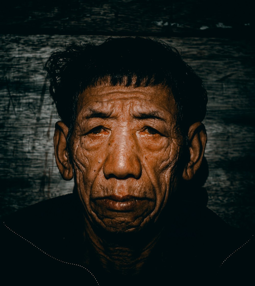 an old man with wrinkles on his face