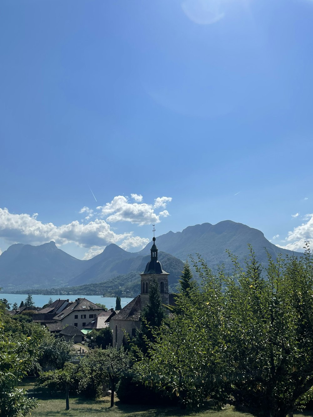 a church with a steeple on a sunny day