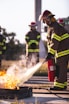 a group of firefighters standing around a fire hydrant