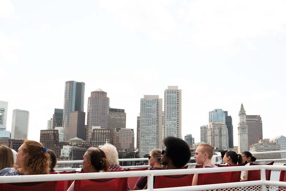 a group of people sitting on top of a boat