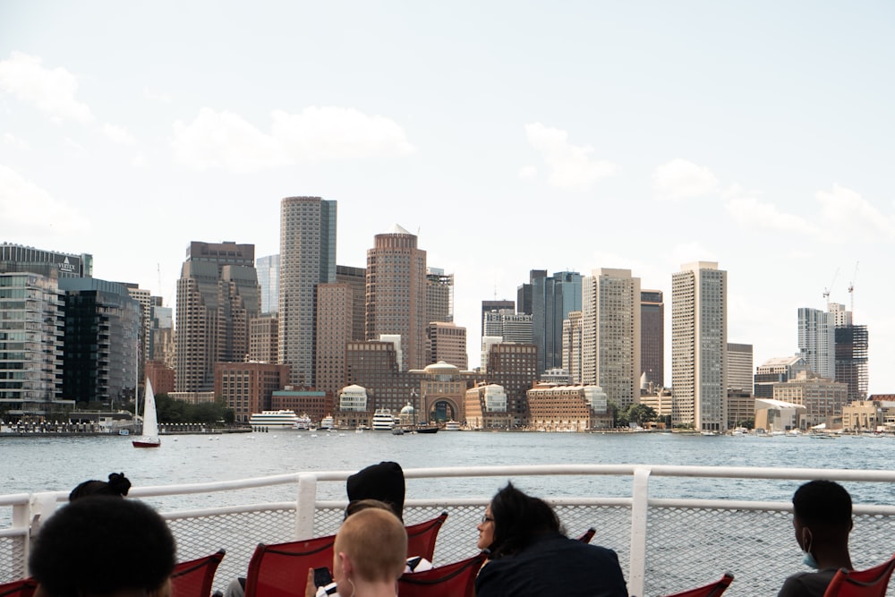 a group of people sitting on top of a boat