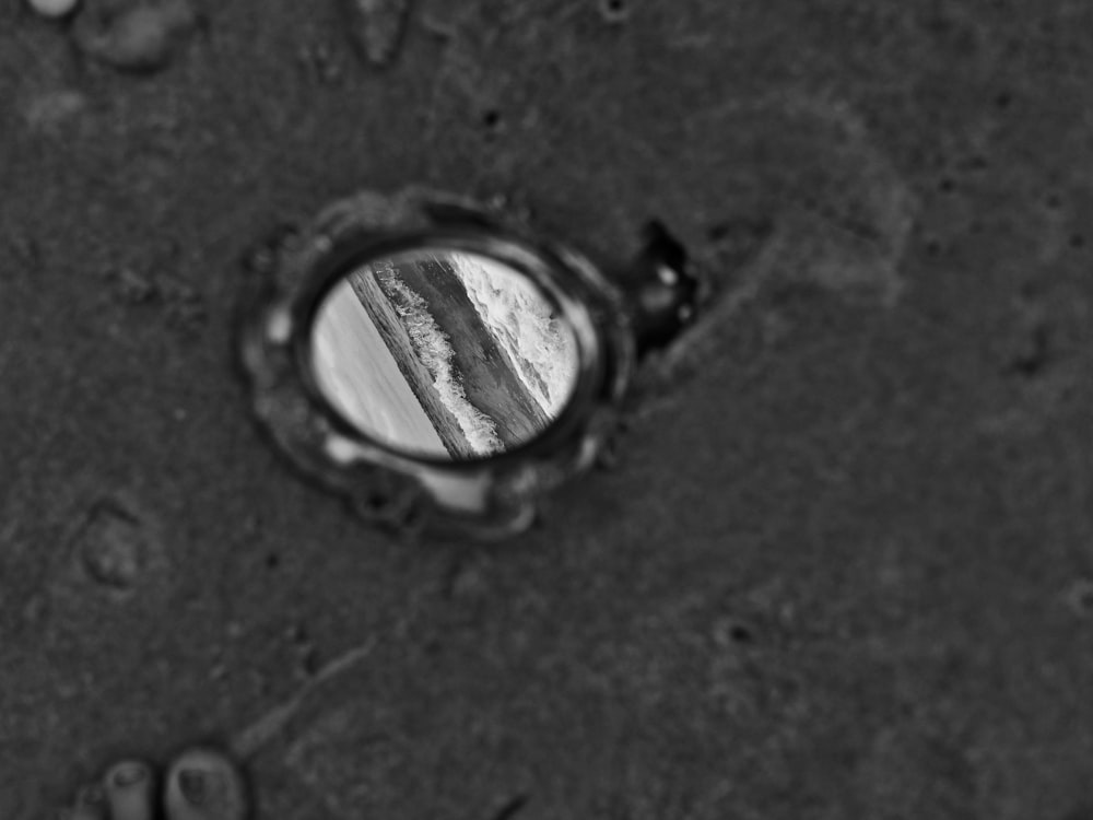a black and white photo of a hole in the ground