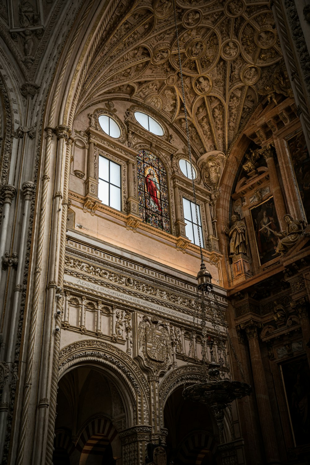 a cathedral with a statue of a person in the window