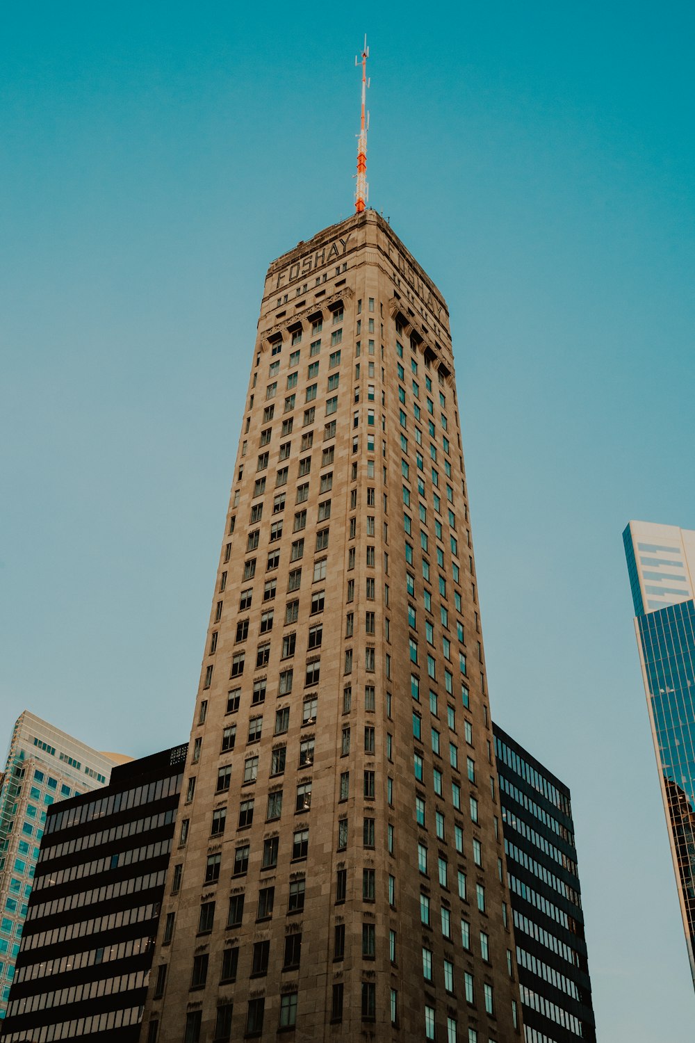 a very tall building with a sky background