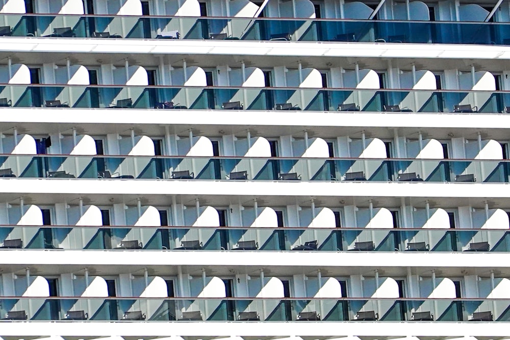 a large white building with balconies and balconies