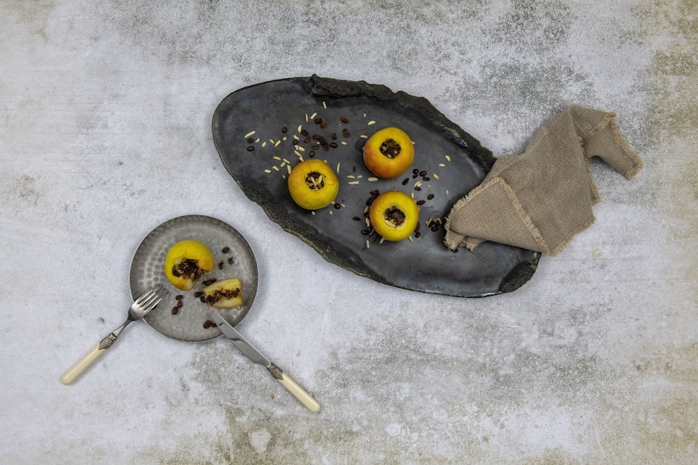 a plate of food with lemons on it