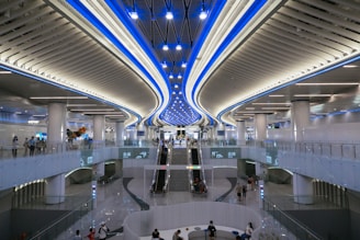 a group of people walking around a building