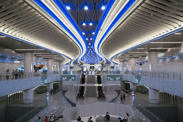 a group of people walking around a building
