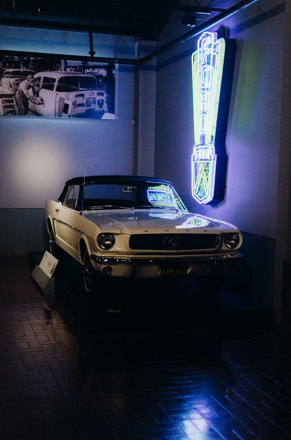 an old car is on display in a museum