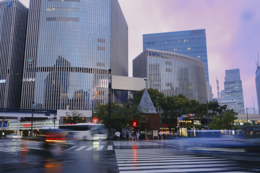 a city street filled with lots of tall buildings