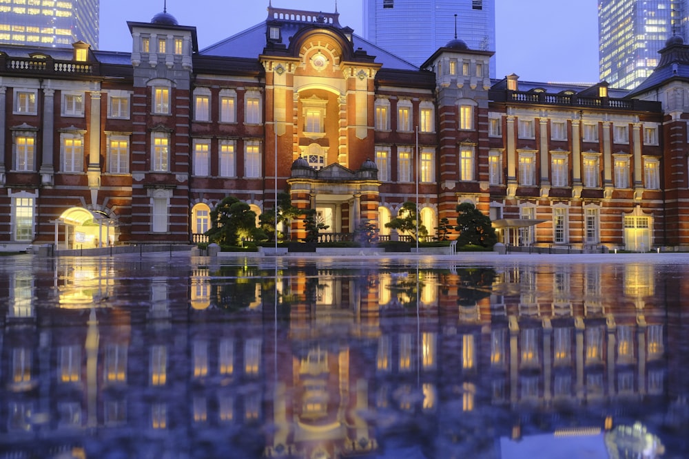 a large building with a fountain in front of it