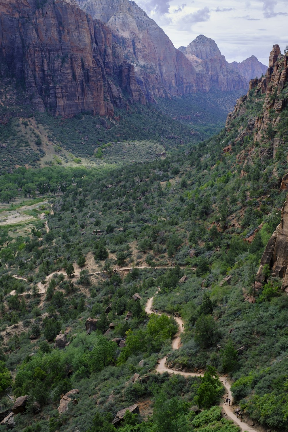 a scenic view of a valley and mountains