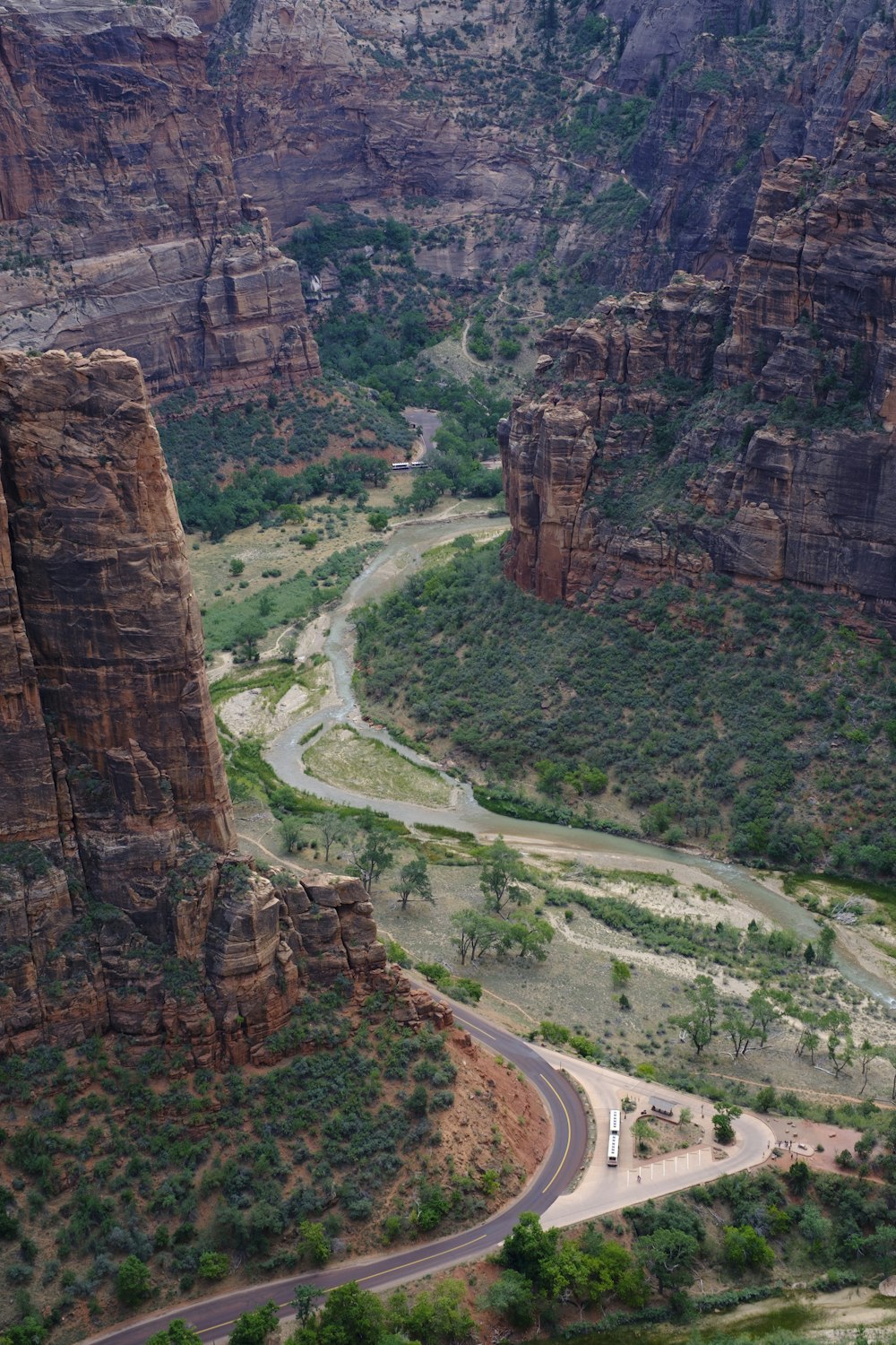 a truck driving down a road in the mountains