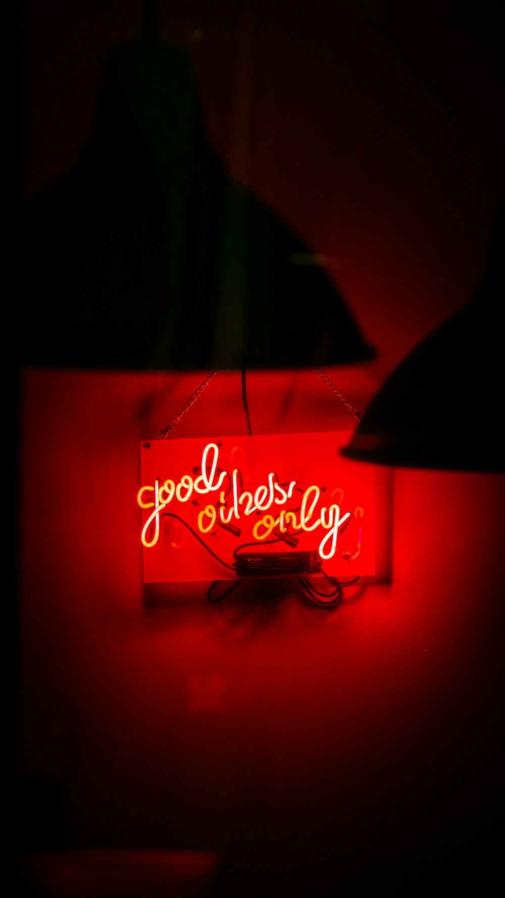 a red neon sign that says good luck and money