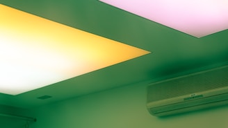 a air conditioner mounted on the ceiling of a room