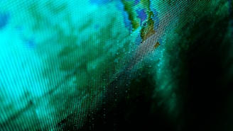 a close up of a computer screen with a map of the world on it