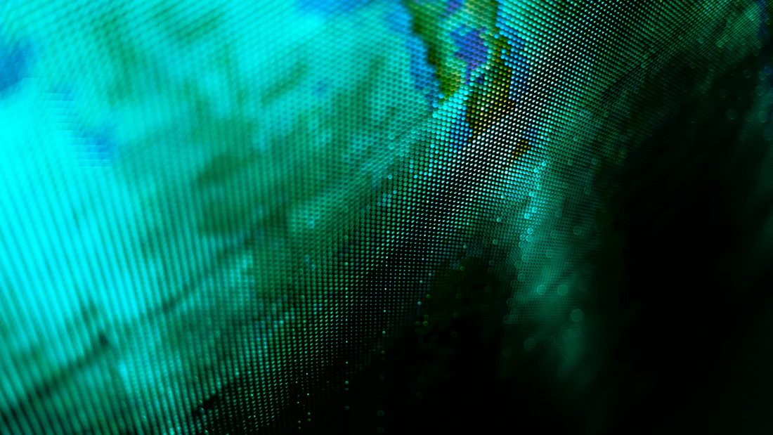 A world map rendered across a green LED display